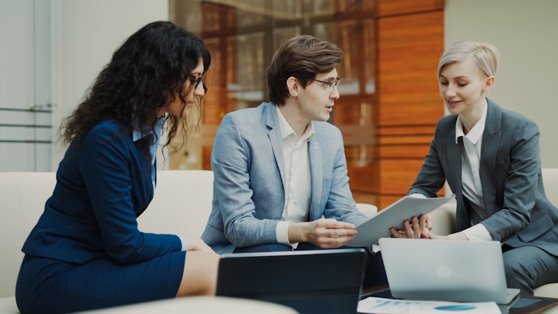 Professionals reviewing financial documents at a table
