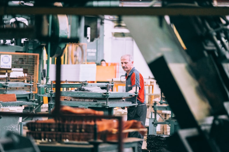 Factory worker operating industrial machinery